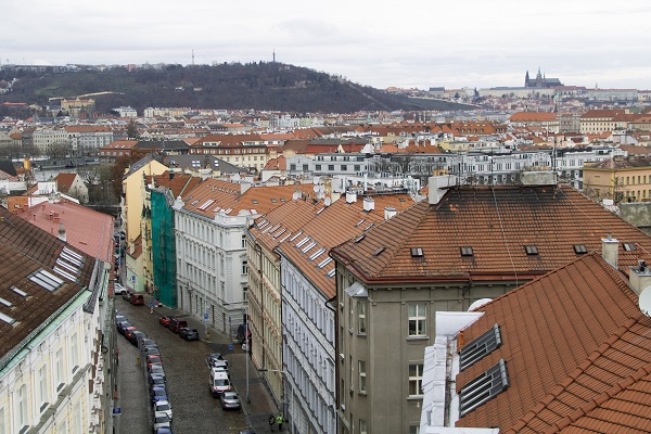 View of rooftops and an old cobblestone street